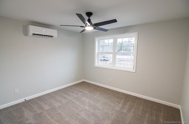 carpeted spare room featuring ceiling fan and a wall mounted air conditioner