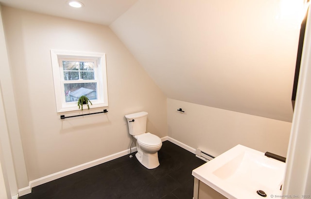 bathroom with baseboard heating, toilet, vanity, and vaulted ceiling