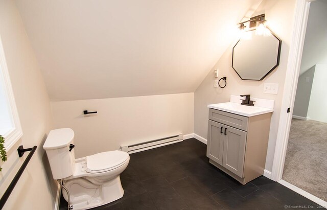 bathroom featuring vaulted ceiling, toilet, vanity, and a baseboard radiator