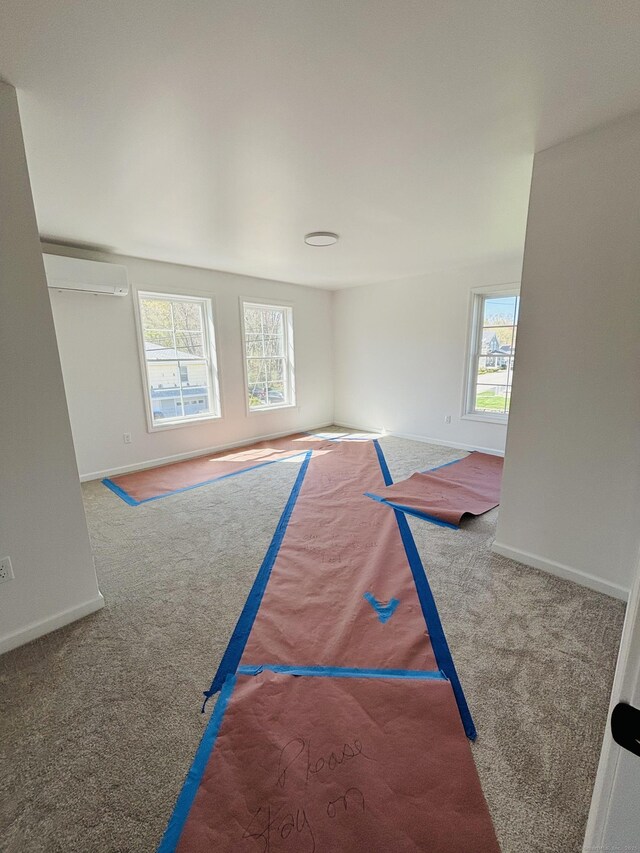 16 Red Bridge Rd, Thompson, CT 06255 - rec room with carpet flooring, baseboards, and a wall mounted AC