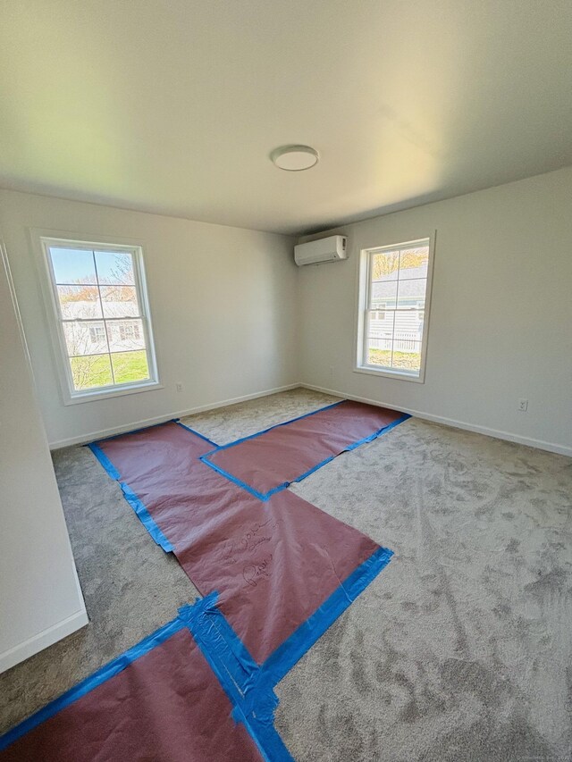 16 Red Bridge Rd, Thompson, CT 06255 - carpeted empty room featuring an AC wall unit and baseboards