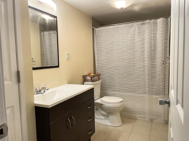 bathroom with tile patterned floors, vanity, toilet, and a shower with curtain