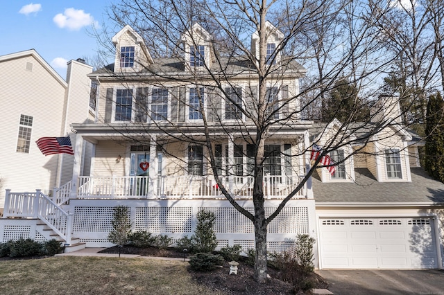 view of front of house featuring a porch and a garage