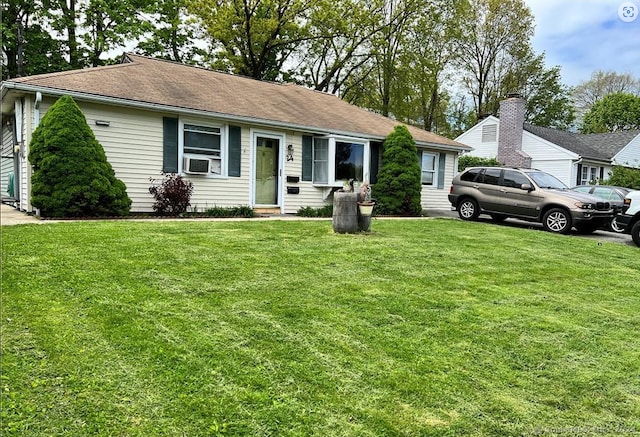 single story home featuring a front yard