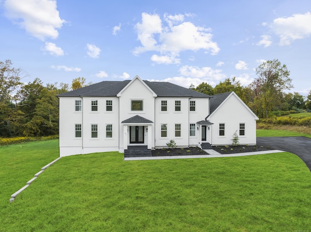 colonial home with a front yard