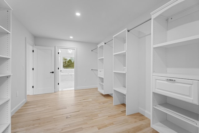 walk in closet featuring light hardwood / wood-style floors