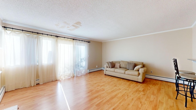 living room featuring crown molding, hardwood / wood-style floors, a textured ceiling, and a baseboard heating unit