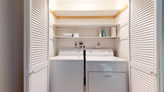 laundry area with washing machine and clothes dryer