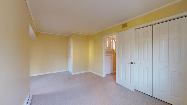 unfurnished bedroom with light colored carpet, a closet, and crown molding