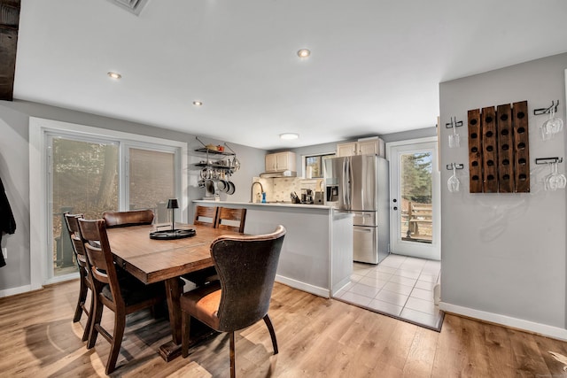 dining room featuring light hardwood / wood-style flooring and sink