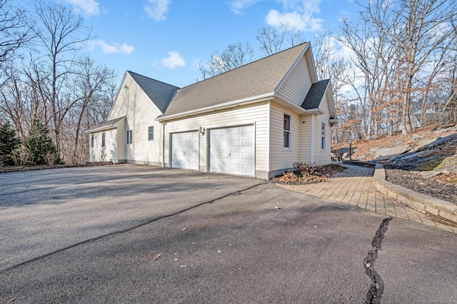 view of side of home with a garage