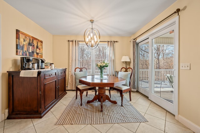 tiled dining room with a notable chandelier