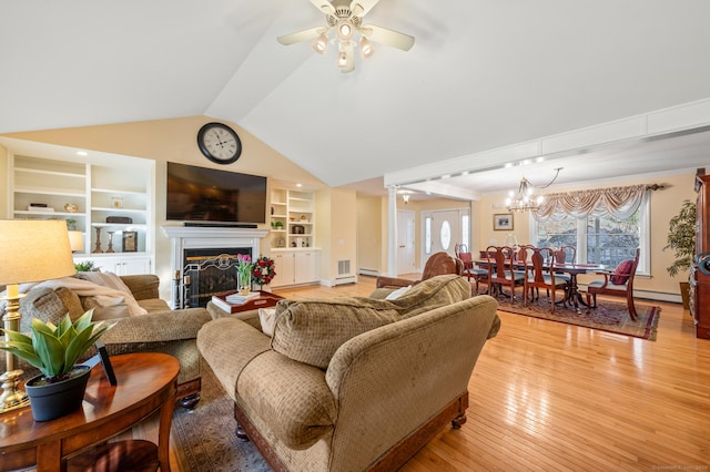 living room featuring lofted ceiling, ceiling fan with notable chandelier, built in shelves, a baseboard radiator, and light hardwood / wood-style floors