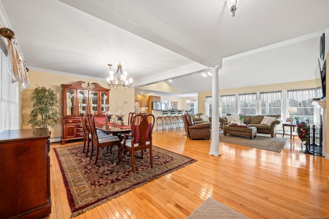 dining room with decorative columns, light wood-type flooring, ornamental molding, beamed ceiling, and a chandelier