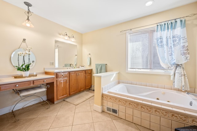 bathroom featuring tile patterned floors, vanity, and a relaxing tiled tub