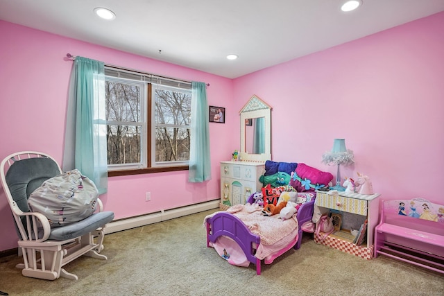 bedroom with carpet and a baseboard heating unit