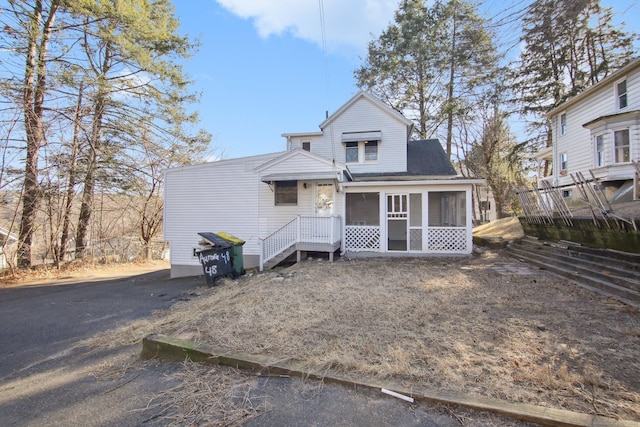 view of front of property with a sunroom