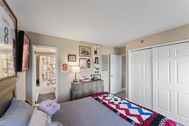 bedroom with connected bathroom and a closet