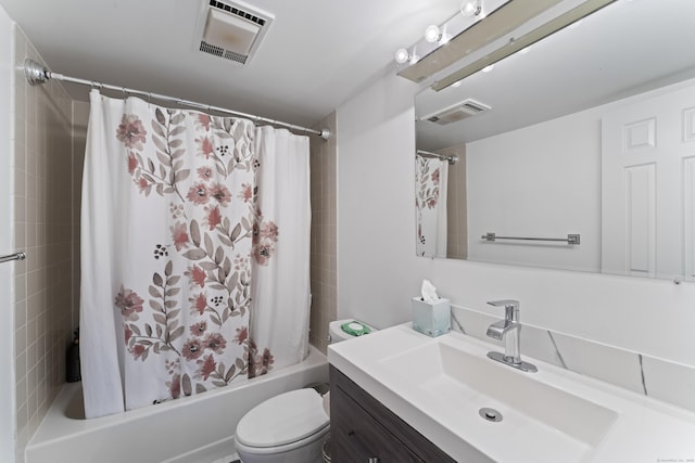 full bathroom featuring shower / tub combo with curtain, vanity, and toilet