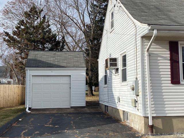 view of side of home with an outbuilding and a garage