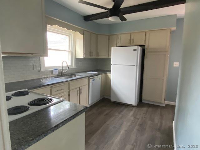 kitchen with white appliances, ceiling fan, sink, cream cabinets, and dark hardwood / wood-style floors