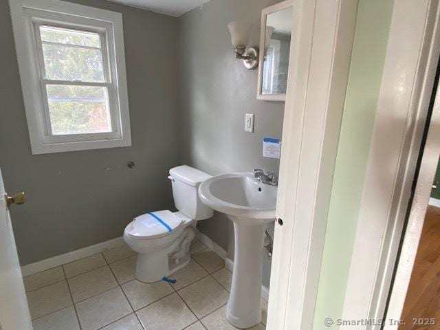 bathroom featuring tile patterned floors and toilet