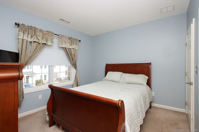 bedroom with light carpet