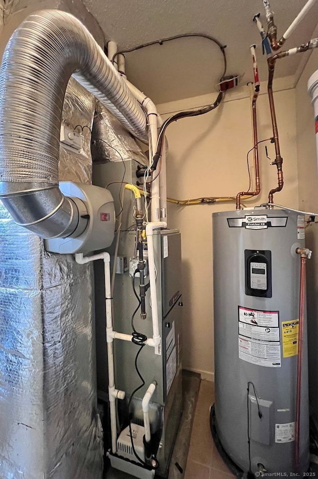 utility room featuring electric water heater