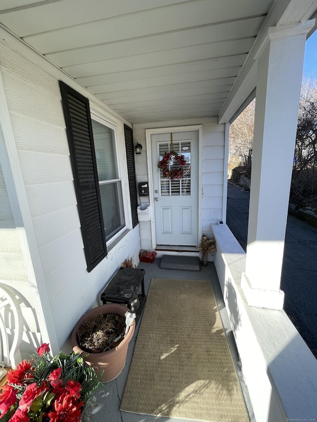 entrance to property with covered porch