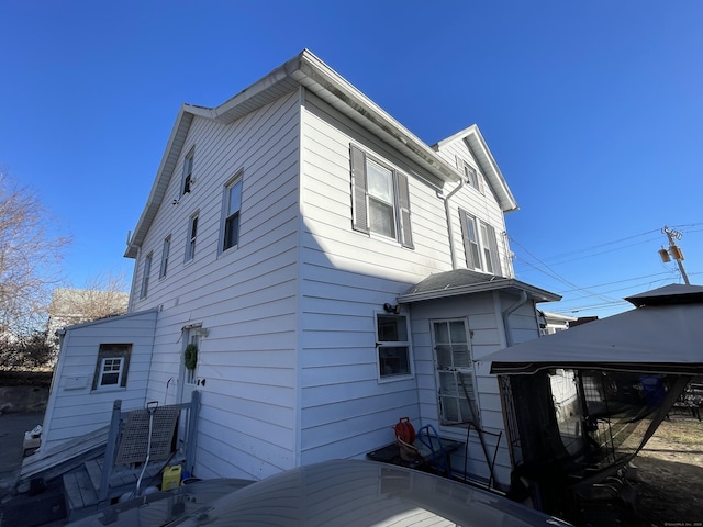 back of house featuring a gazebo