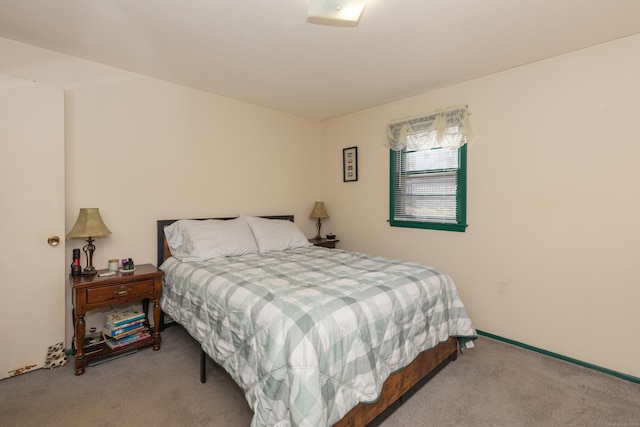 bedroom with light carpet