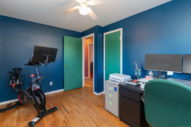 office featuring light wood-type flooring and ceiling fan