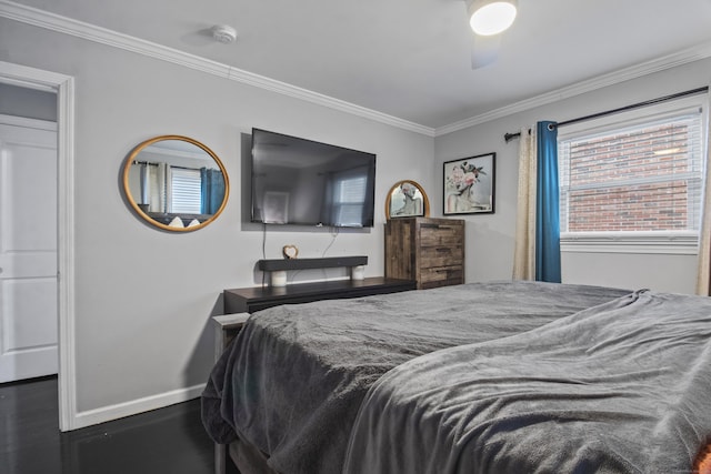 bedroom with dark hardwood / wood-style floors, ceiling fan, and ornamental molding