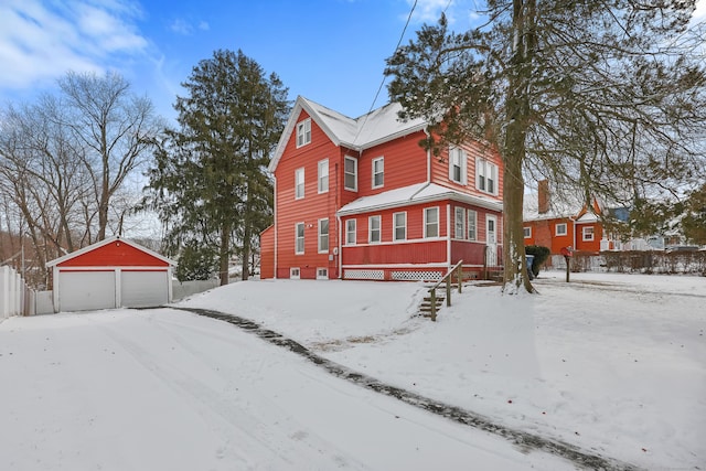 exterior space with an outbuilding and a garage