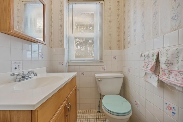 bathroom with toilet and vanity