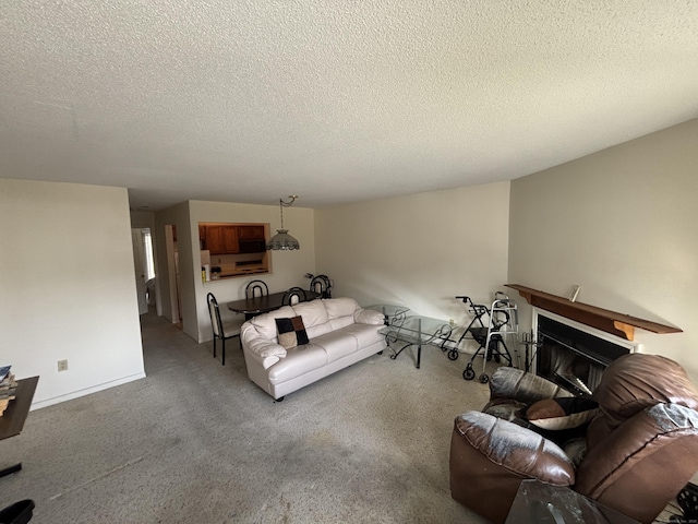 carpeted living room with a textured ceiling