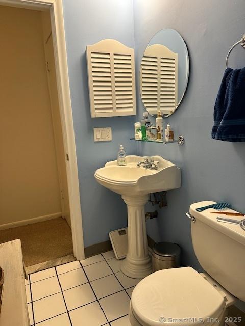 bathroom with tile patterned flooring and toilet