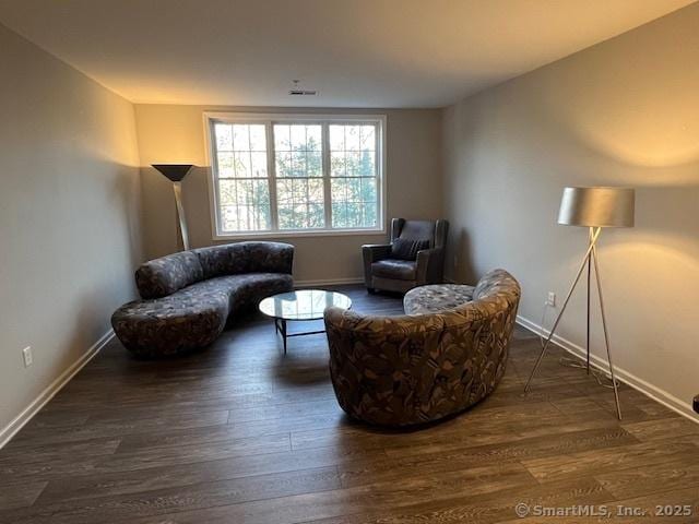 living area with dark wood-type flooring