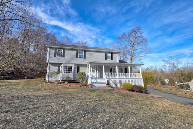 view of front facade with a porch and a front yard