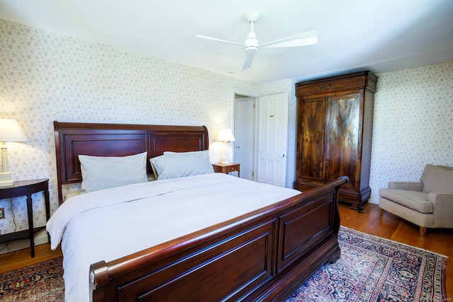 bedroom featuring ceiling fan and dark hardwood / wood-style flooring