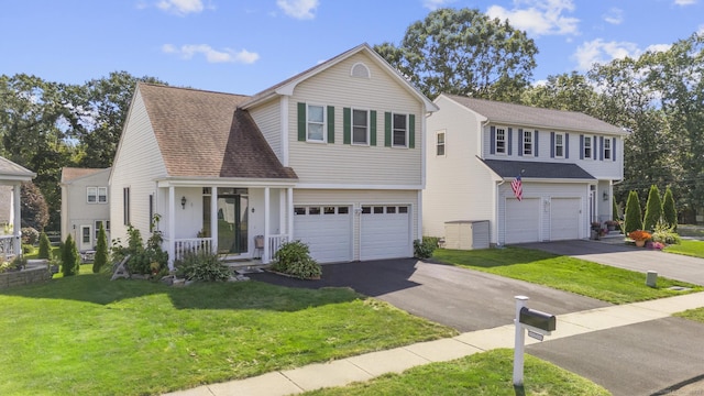 view of front property with a garage and a front lawn