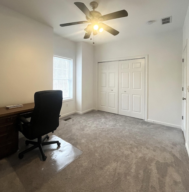 home office featuring carpet flooring and ceiling fan