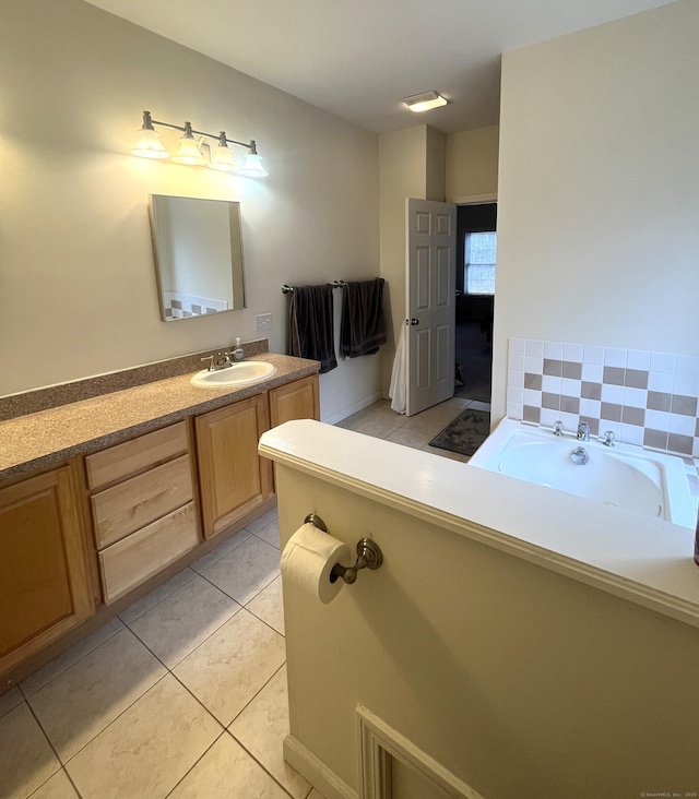 bathroom featuring tile patterned flooring and vanity