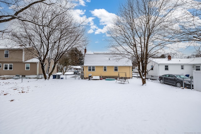 view of snow covered house