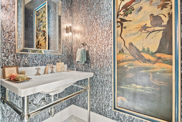 bathroom with wallpapered walls