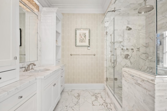 bathroom featuring vanity, baseboards, marble finish floor, ornamental molding, and a marble finish shower