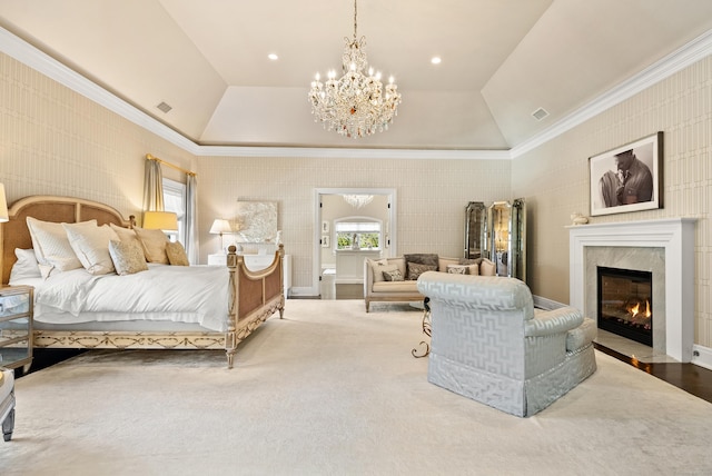 bedroom featuring lofted ceiling, recessed lighting, a high end fireplace, visible vents, and an inviting chandelier