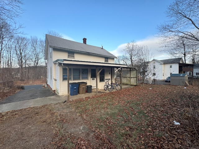 back of house with a patio