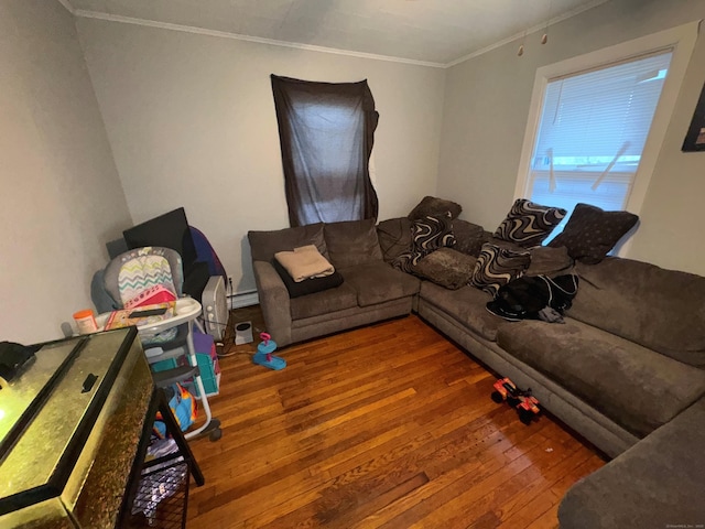 living room featuring wood-type flooring, ornamental molding, and a baseboard heating unit