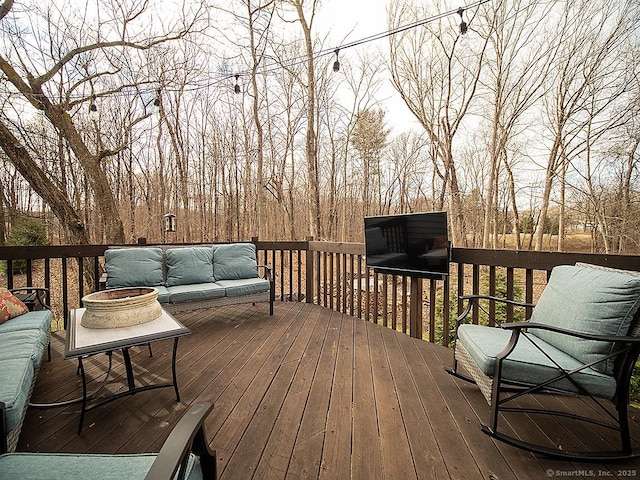 wooden deck featuring an outdoor hangout area